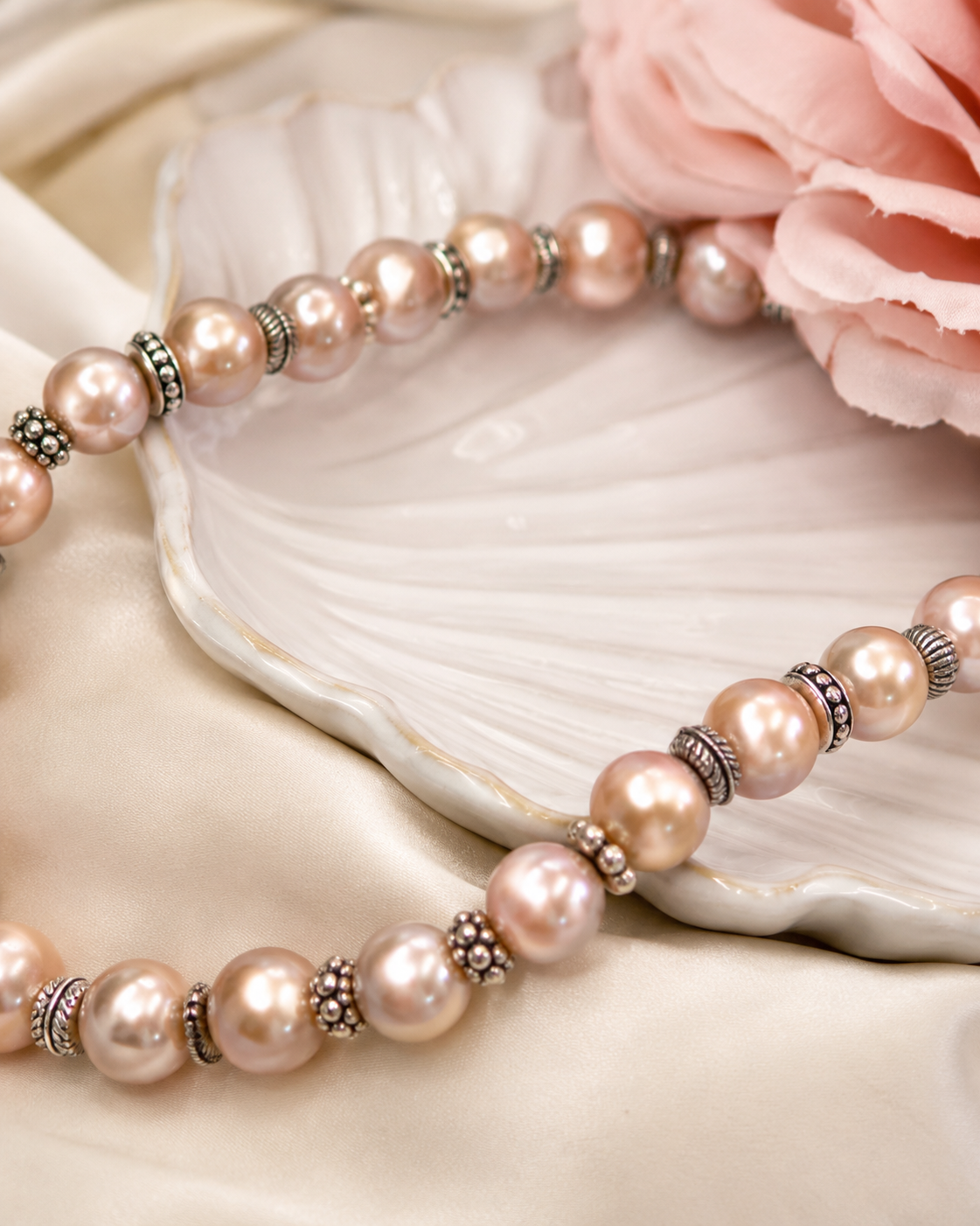Close-up of champagne pink freshwater pearls and vintage silver spacer beads in Aurora Champagne Freshwater Pearl Necklace