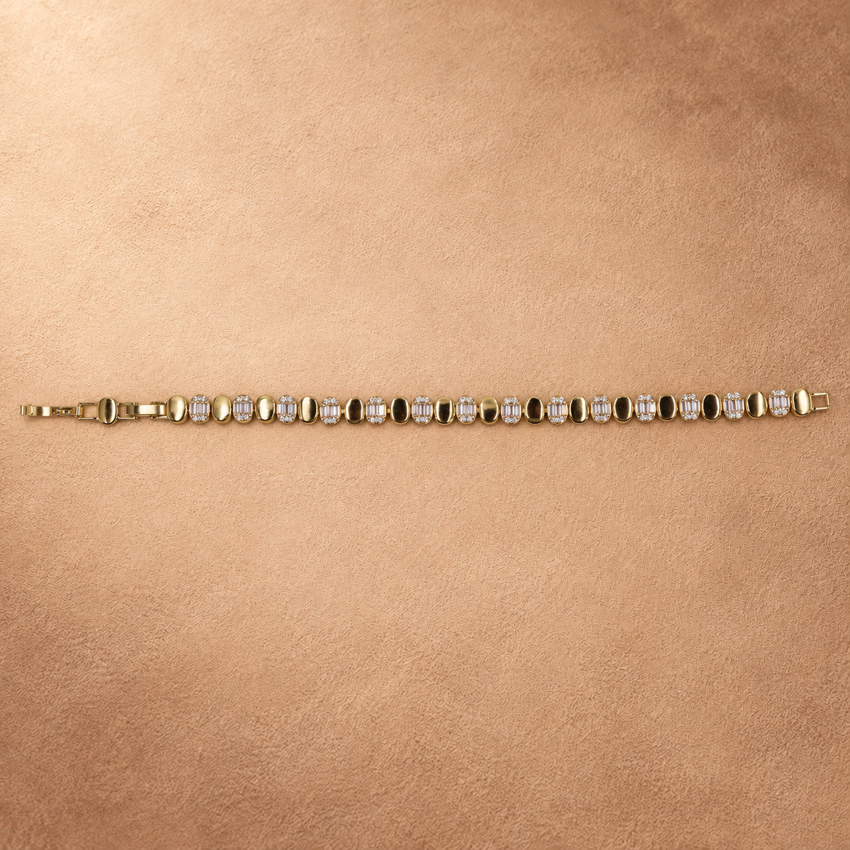 Full-length view of the Dalia bracelet laid straight with the clasp open and alternating polished oval links and clear accents.