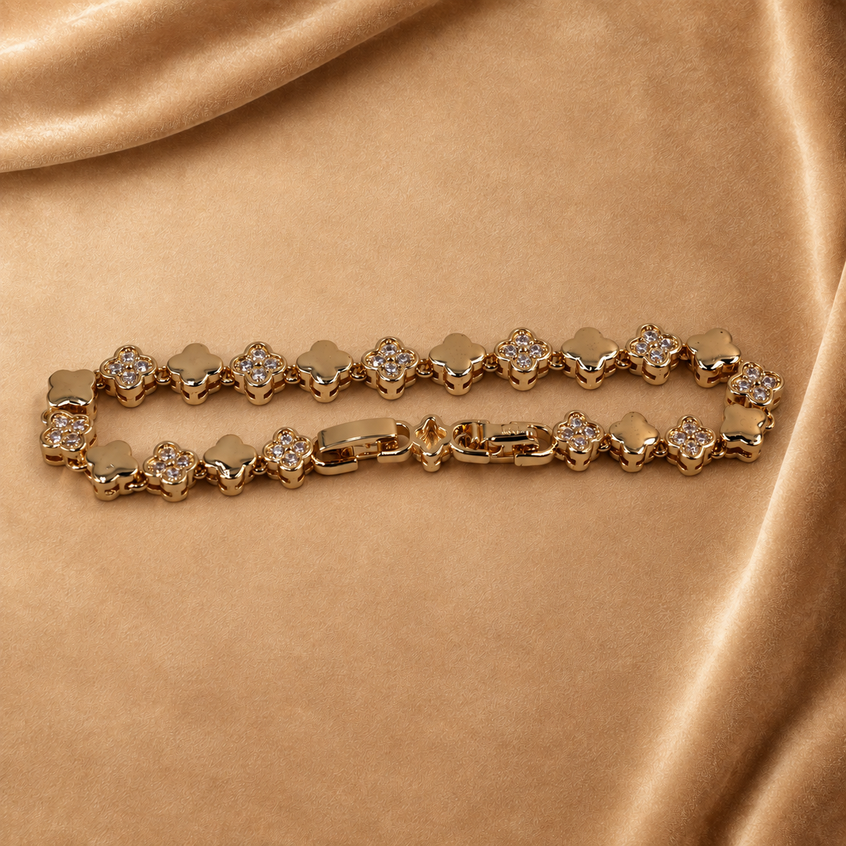 Angled close view of Sylvie clover bracelet, showing raised links, clear accents and the polished clasp.