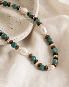 Close-up of amazonite beads, natural pearls, tiger’s eye, and sterling silver accents in Amazonite Pearl Beaded Layering Necklace