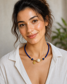 Model wearing Lapis Lazuli Beaded Necklace with Gold-Plated Sterling Silver and a white linen shirt