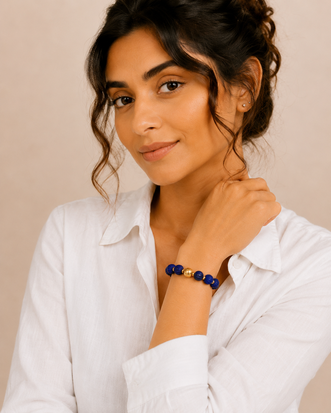 Model wearing Lapis Lazuli Gold Beaded Statement Bracelet with elegant summer outfit