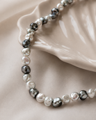 Close-up of white, silver-gray, charcoal, and soft black baroque-style shell pearls in Luna Gray Baroque Shell Pearl Necklace