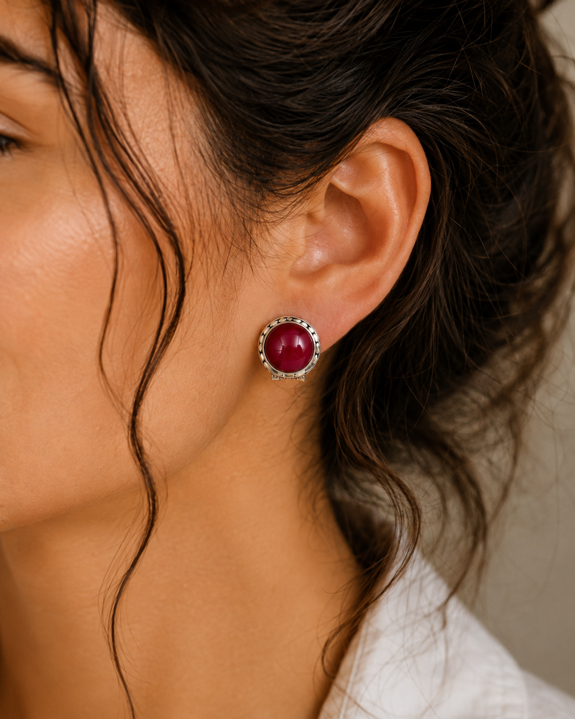 Close-up of ruby cabochon stones and sculptural sterling silver details 