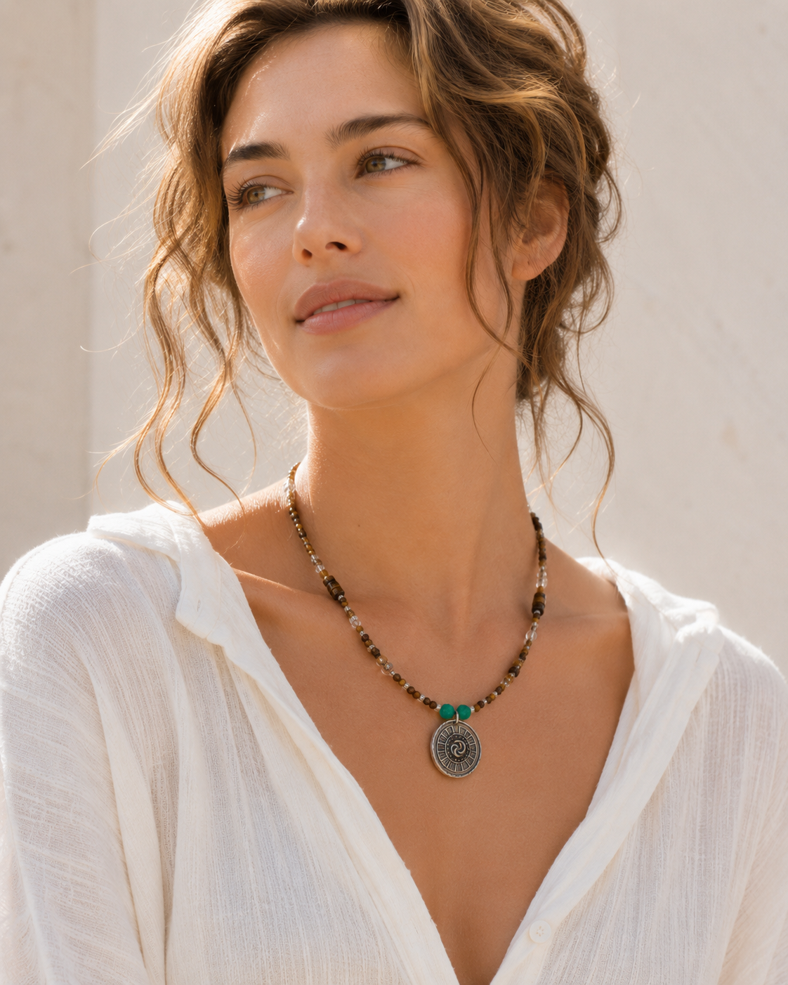 Model wearing Solstice Tiger’s Eye Quartz Pendant Necklace with white linen summer outfit