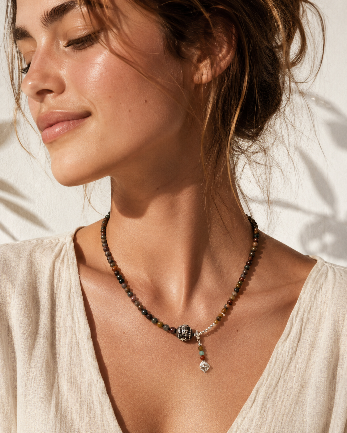 Model wearing Terra Pietersite Sterling Silver Pendant Necklace with relaxed summer outfit