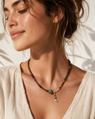 Model wearing Terra Pietersite Sterling Silver Pendant Necklace with relaxed summer outfit