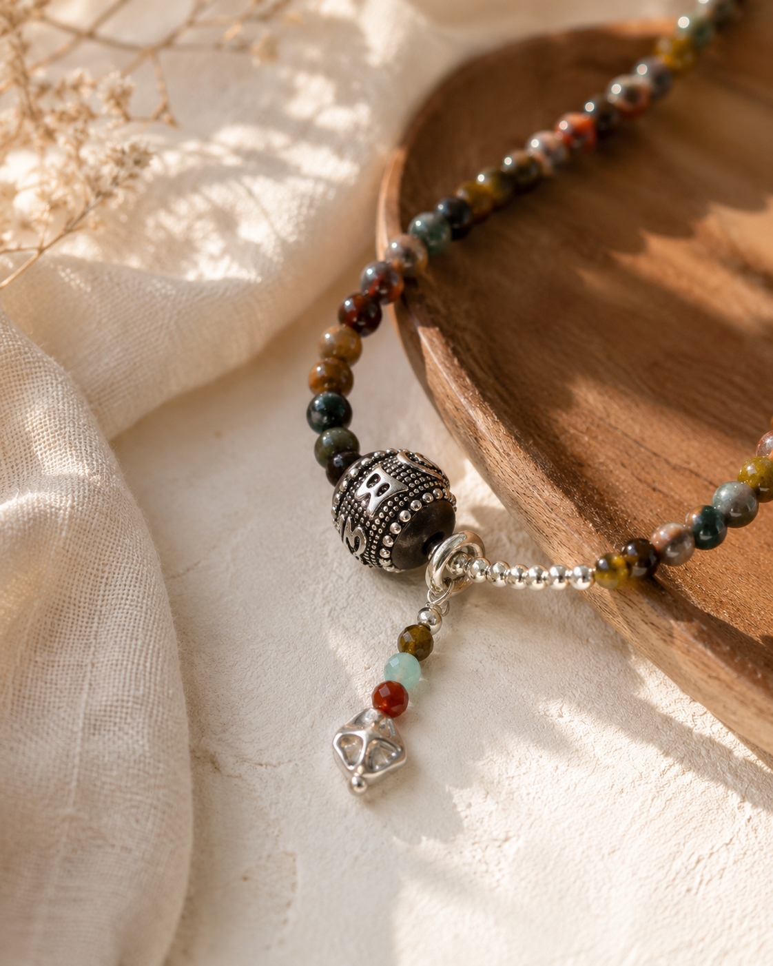 Close-up of pietersite beads, natural earthy tones, and sterling silver pendant in Terra Pietersite Sterling Silver Pendant Necklace